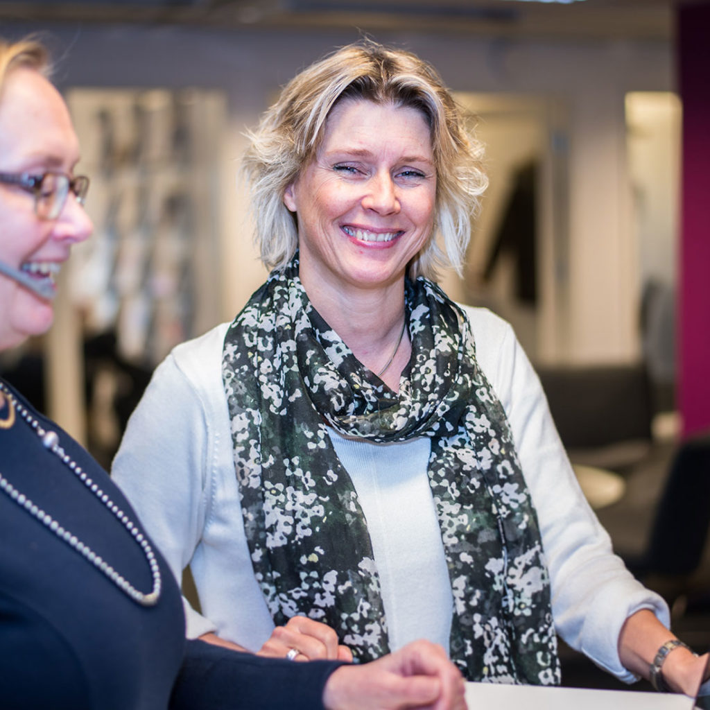 Female librarian smiling