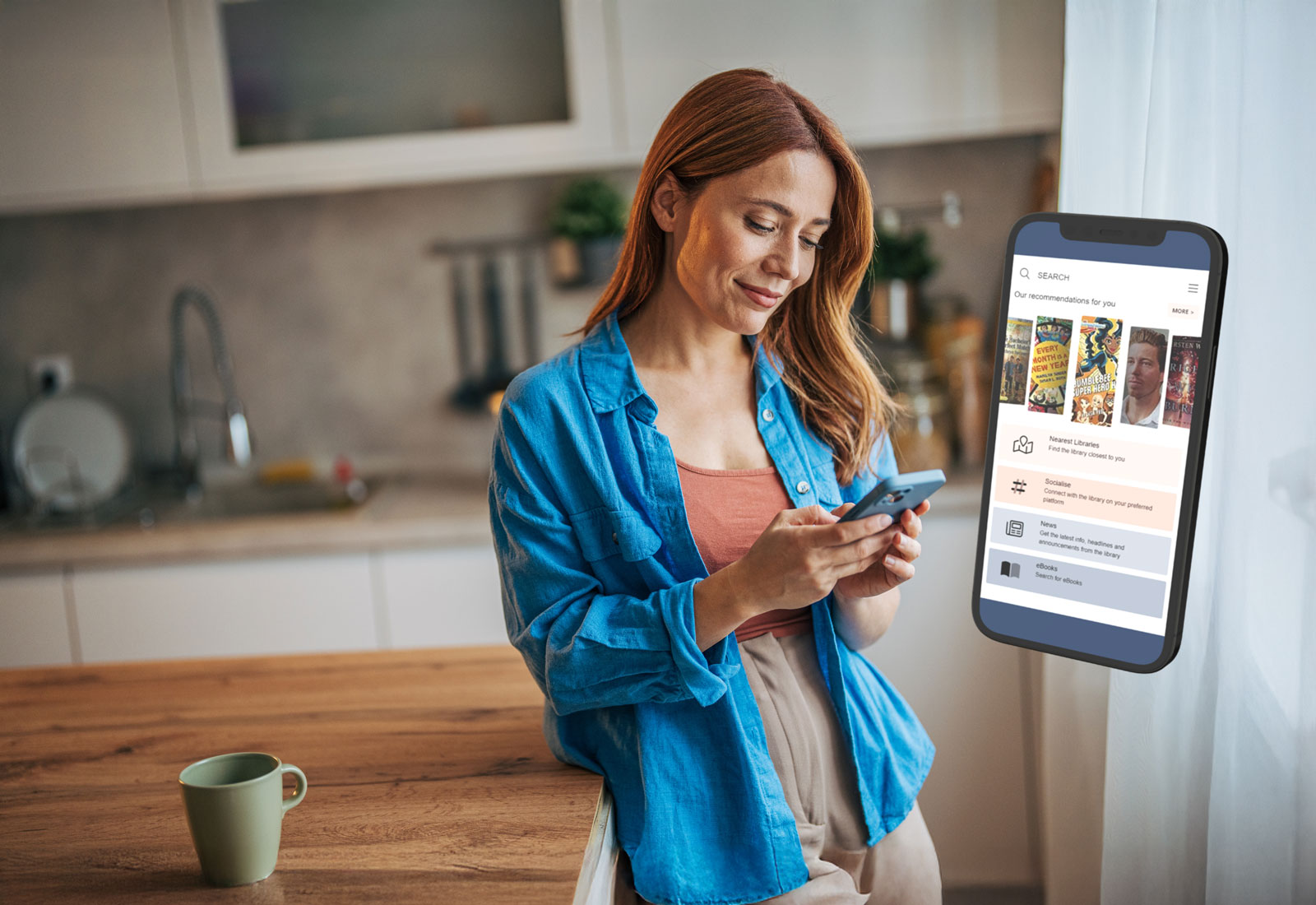 woman in kitchen scrolling phone
