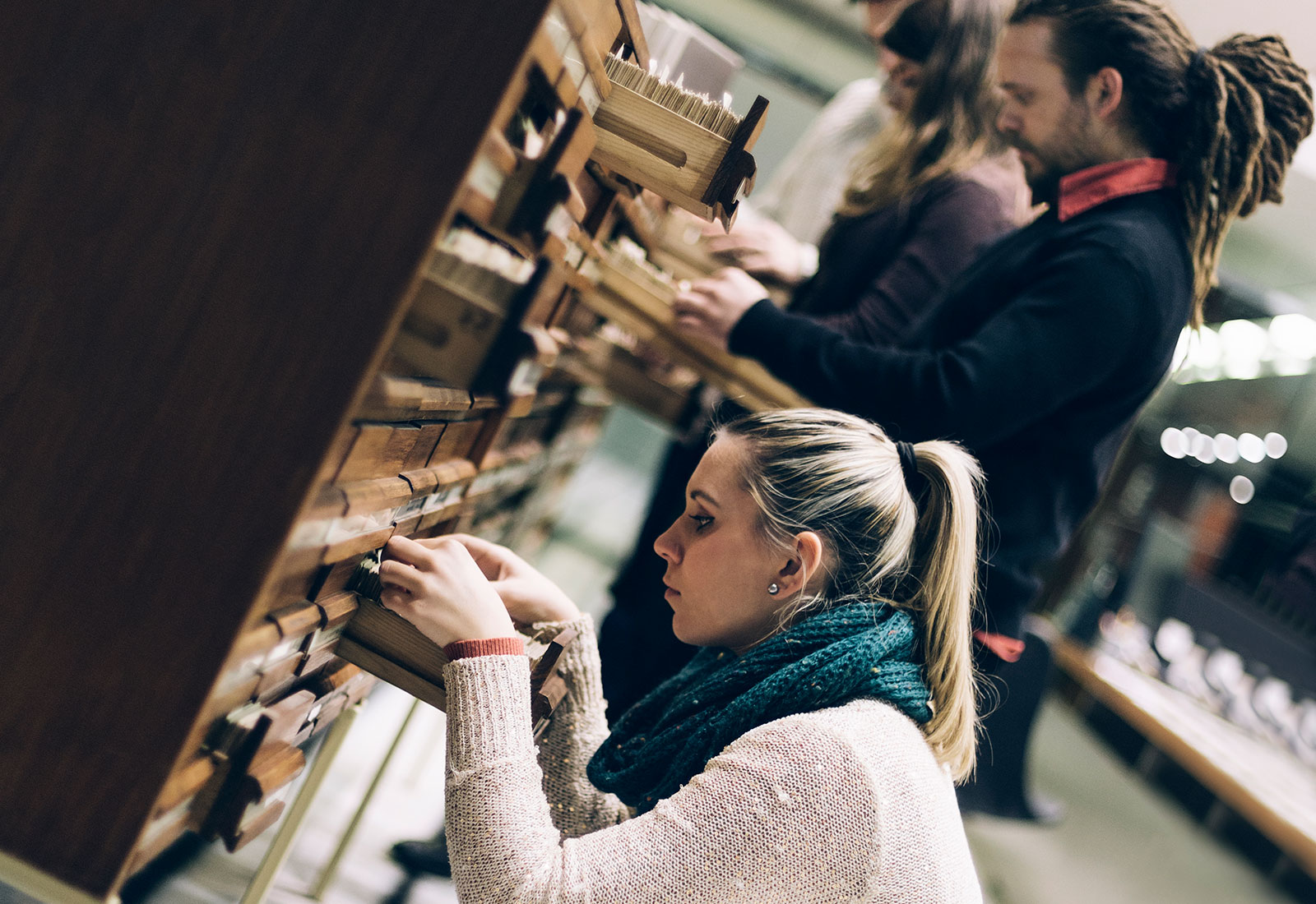 Adults searching through Archives