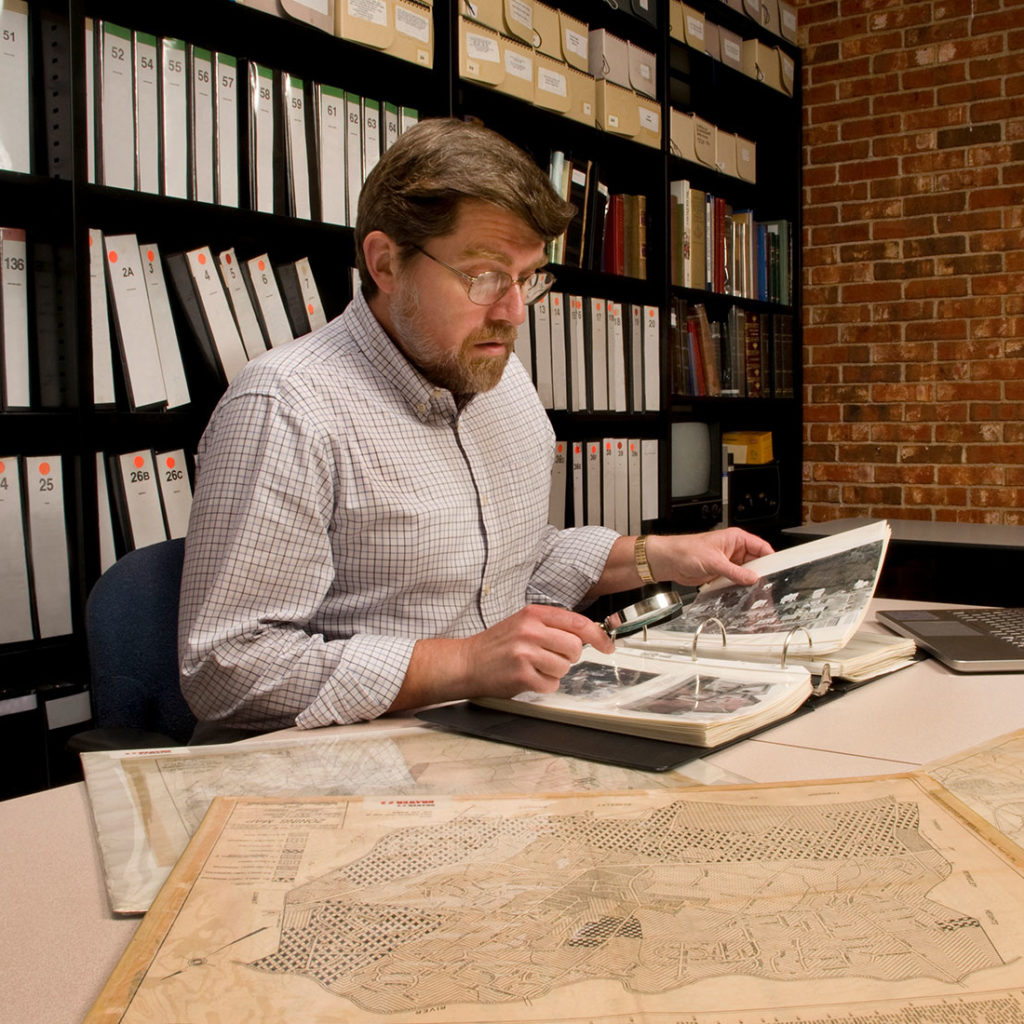 Man viewing archived pictures